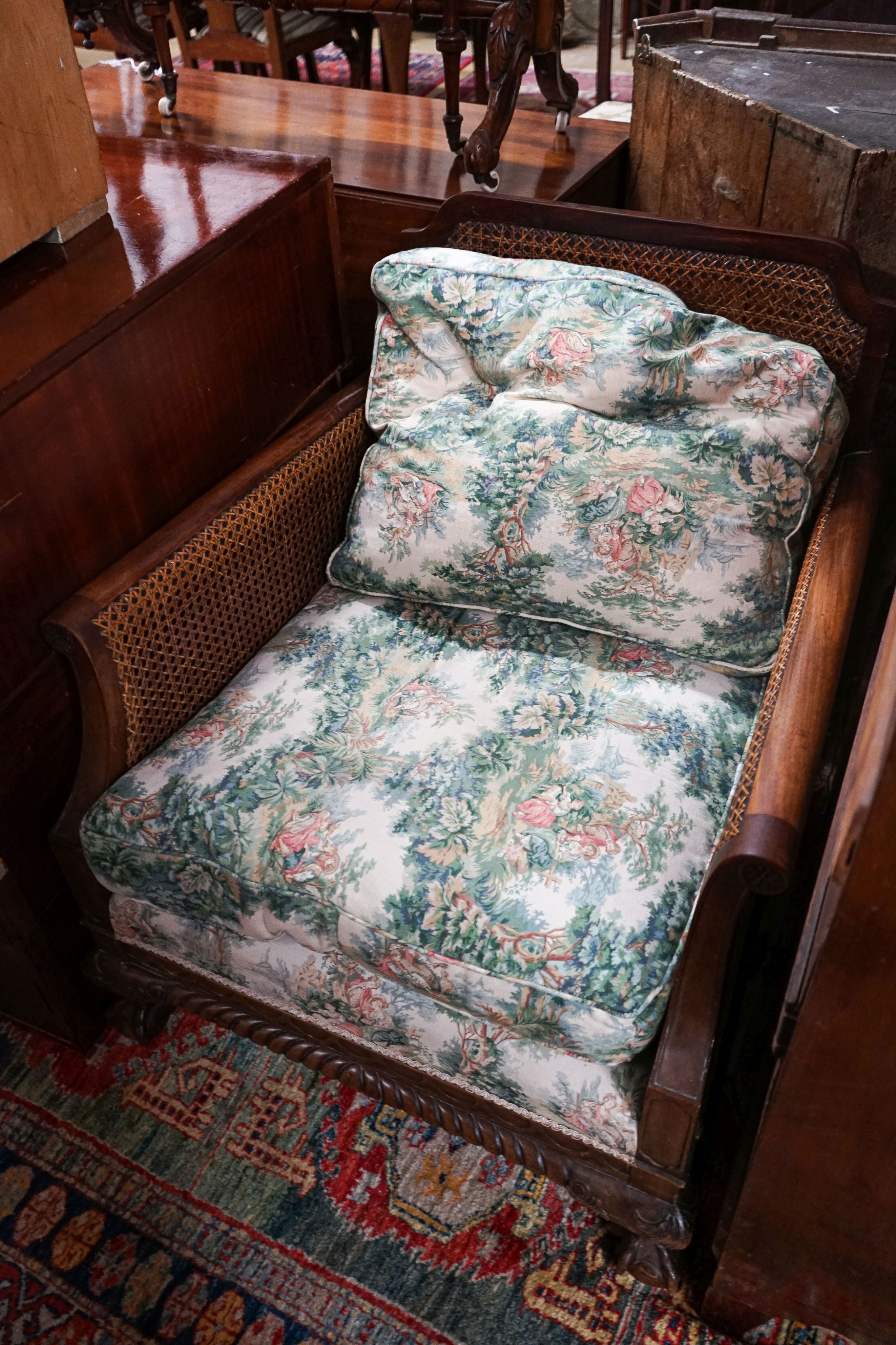 A 1920's mahogany single caned bergere armchair, width 75cm, depth 80cm, height 80cm